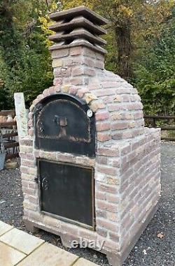Brick outdoor wood fired pizza oven
